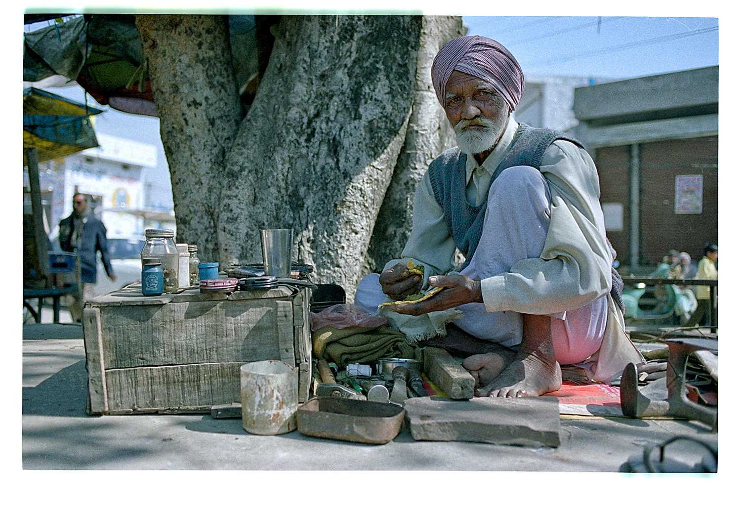 Portrait of shoeblack in Punjab