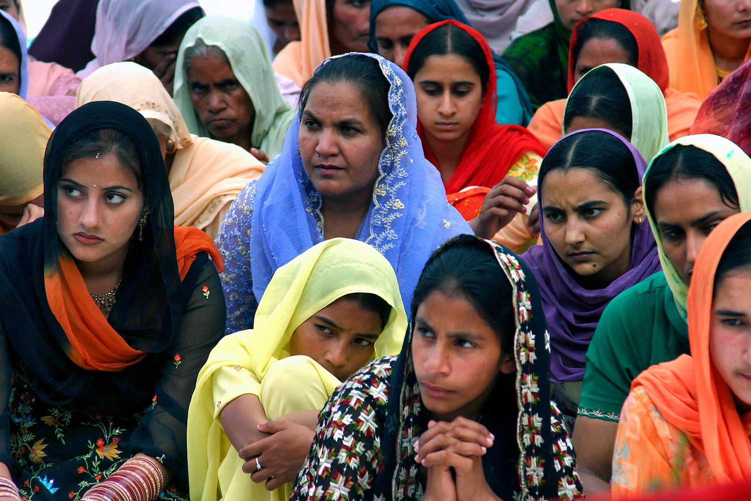 Women sitting at wedding ceremony Punjab