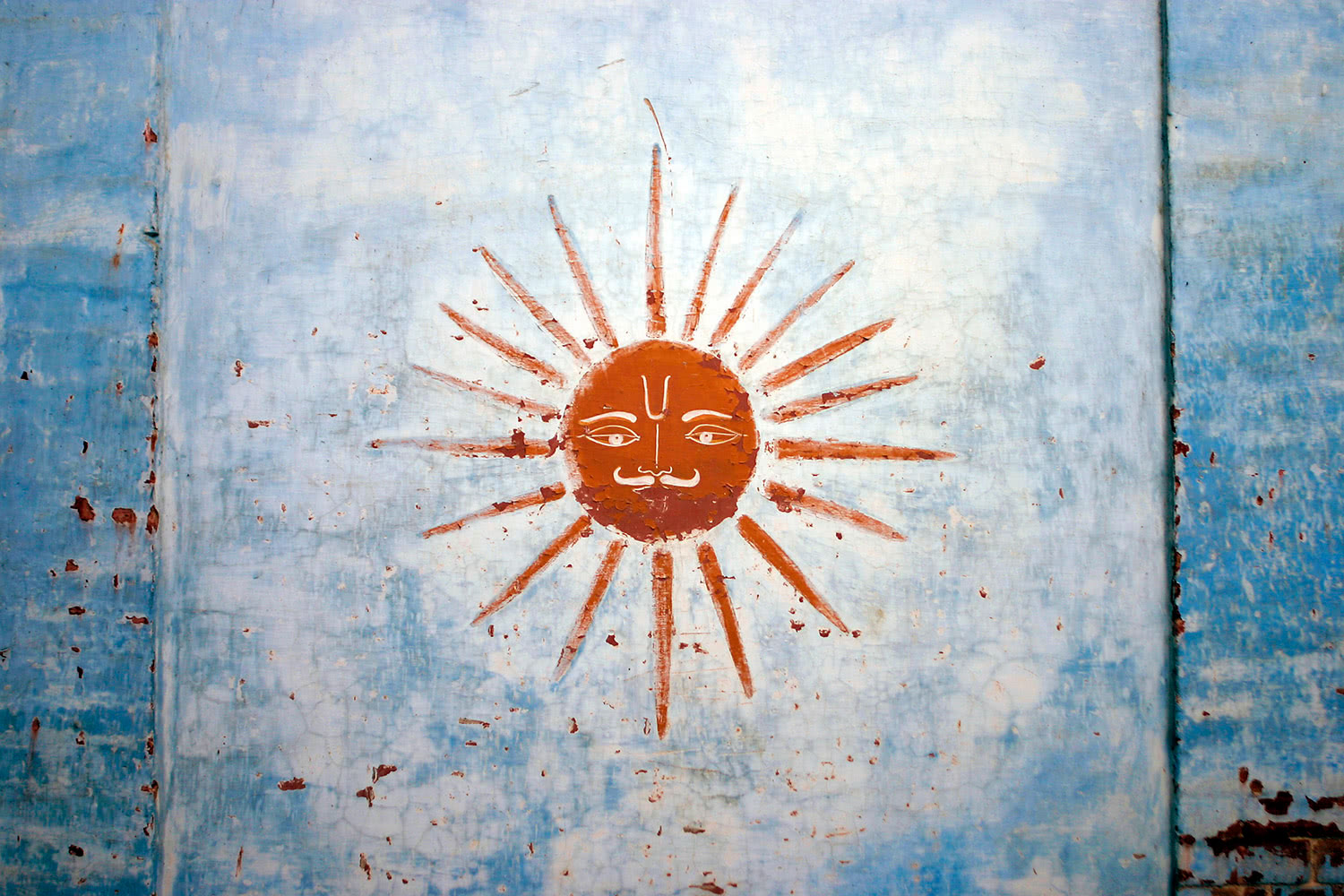 Sun artwork on wall