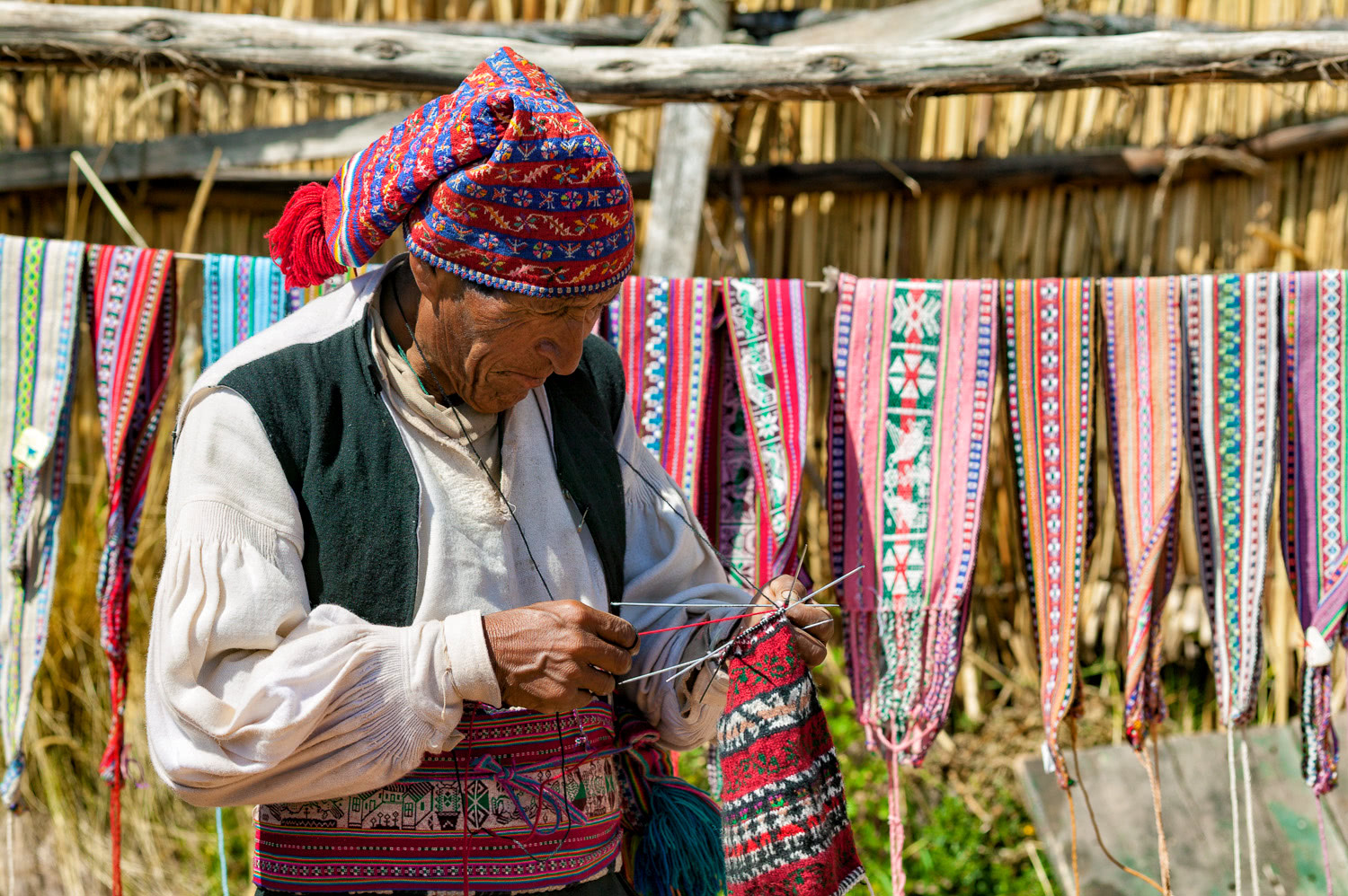 Old man knitting Amantani Island Peru