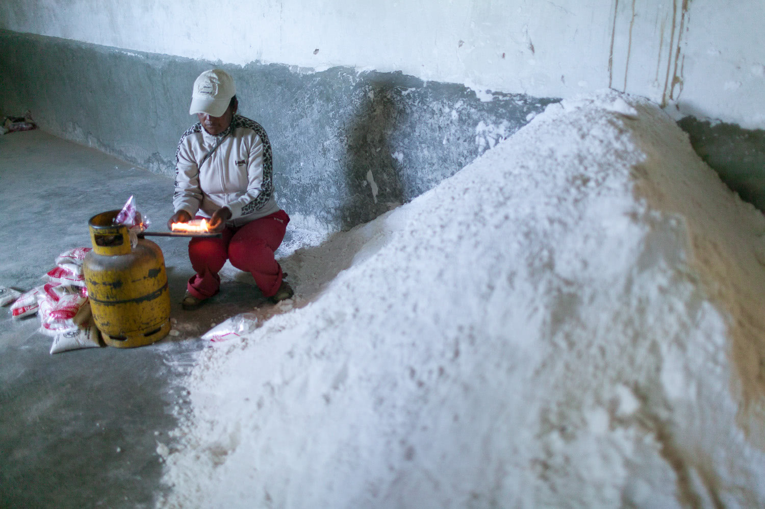 Lady packing salt Salar de Uyuni Bolivia
