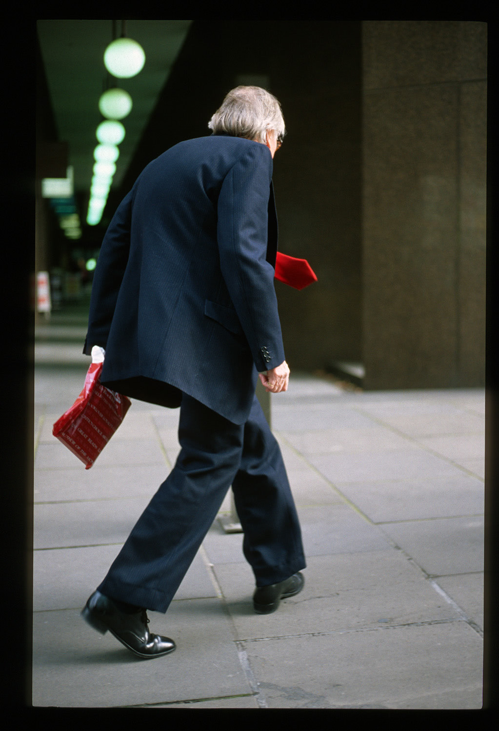 Old man in suit walking Melbourne