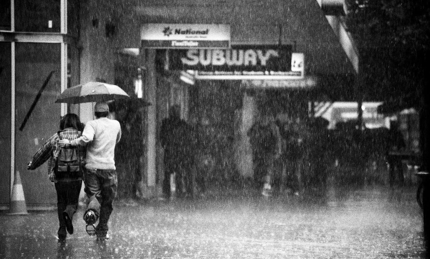 Running in rain Melbourne city