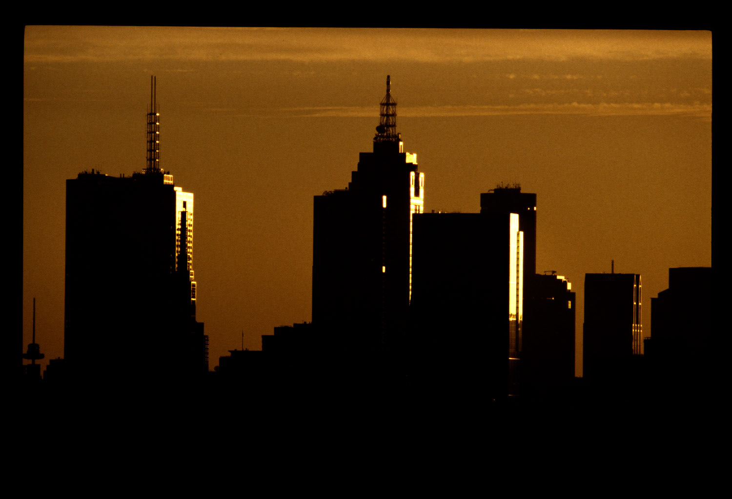 Melbourne city buildings silhouette sunset
